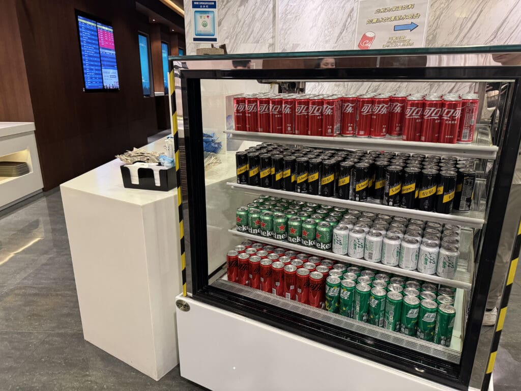 a display case with cans of soda