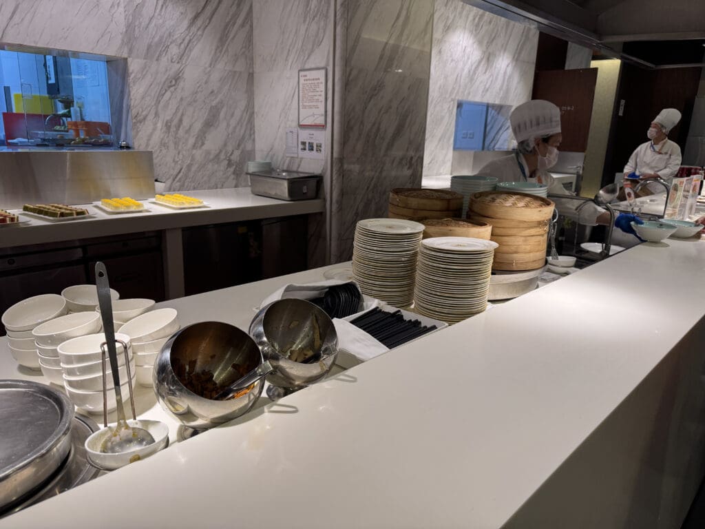 a kitchen with a chef in a white uniform