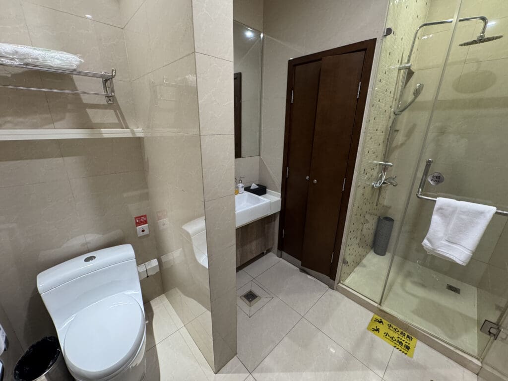 a bathroom with a shower and toilet