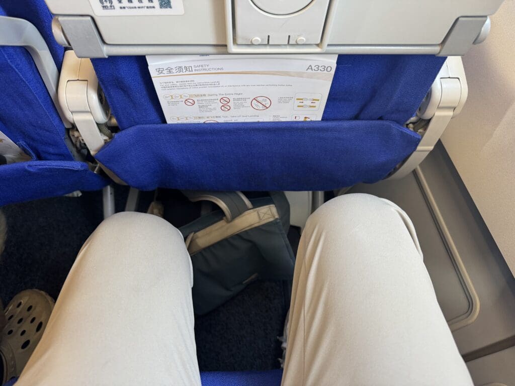 a person's legs in a seat