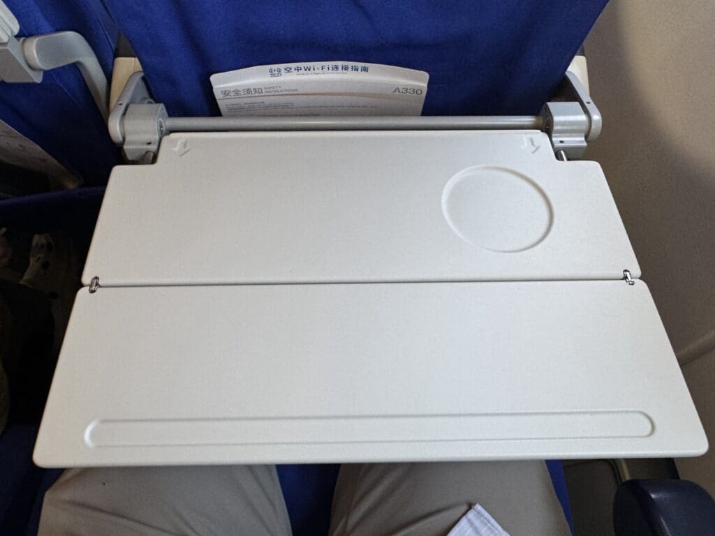 a white rectangular object on a blue chair