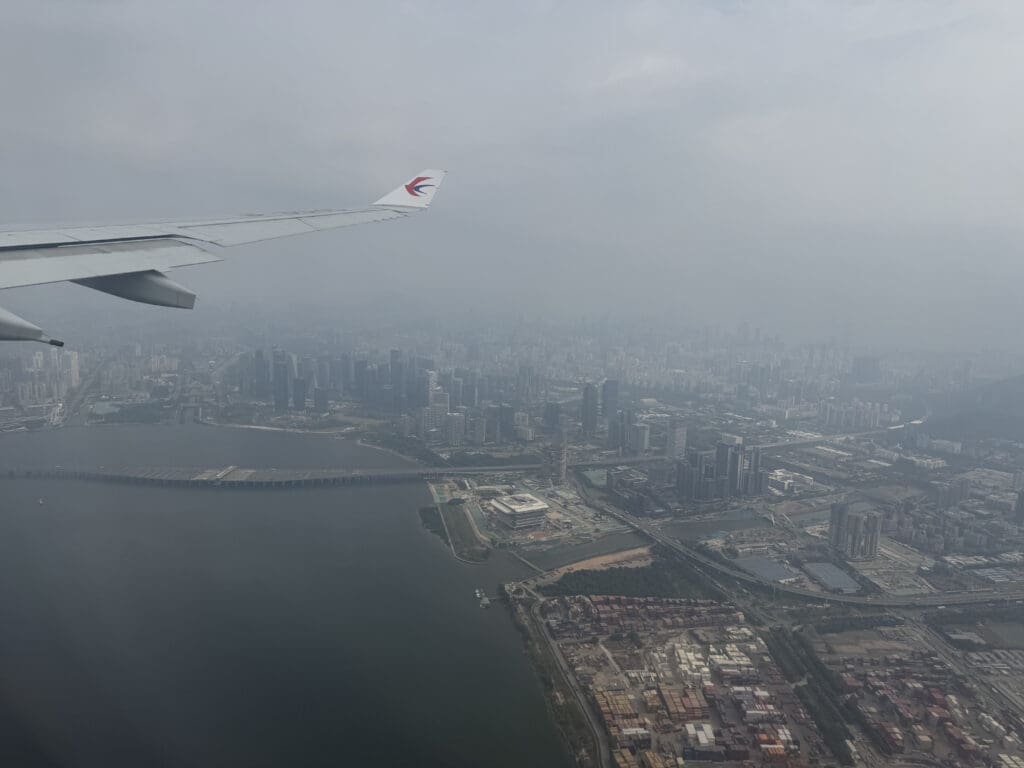 an airplane wing and city view from above