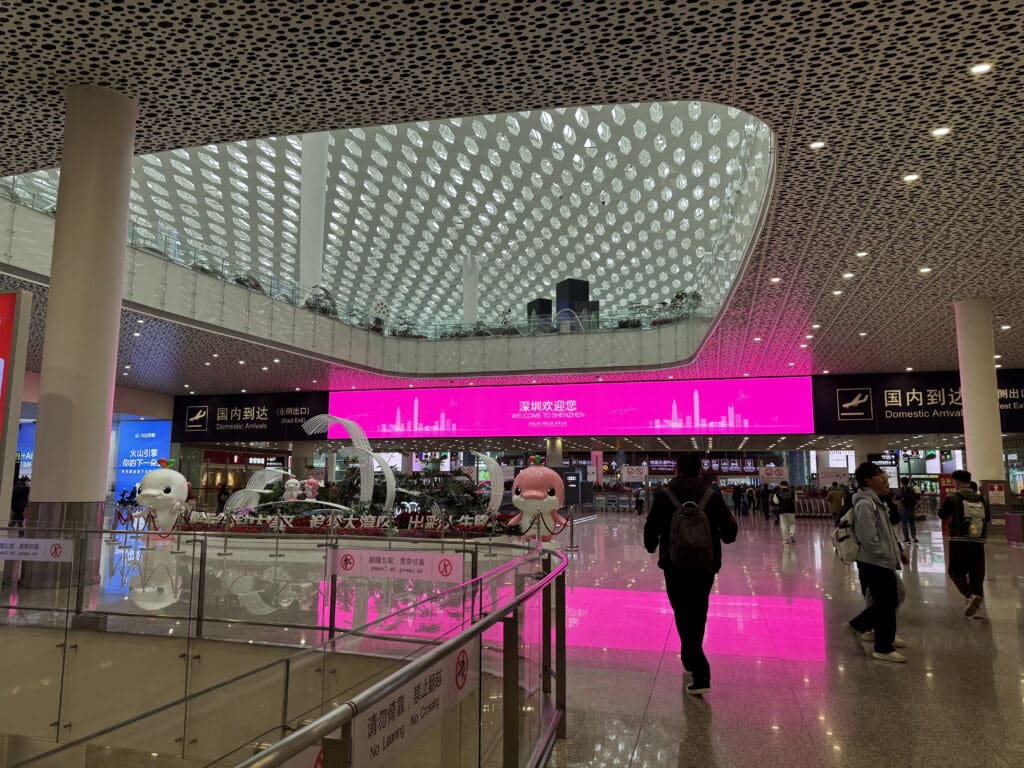 a group of people walking in a large building