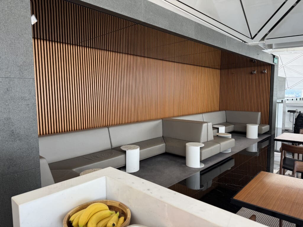a room with a couch and a bowl of bananas