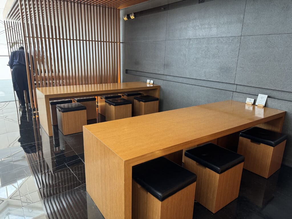 a room with a table and stools