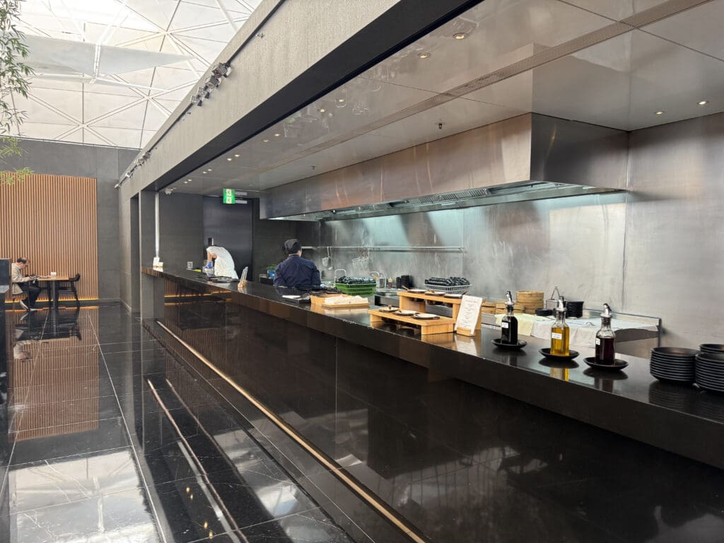 a kitchen with a black counter and a black counter with a black counter and a black counter with a black counter with a black counter with a black counter with a black counter with a black counter with