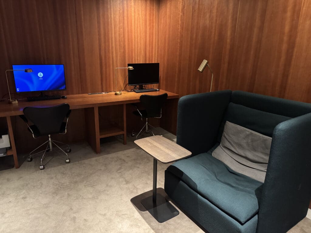 a room with a computer and chair