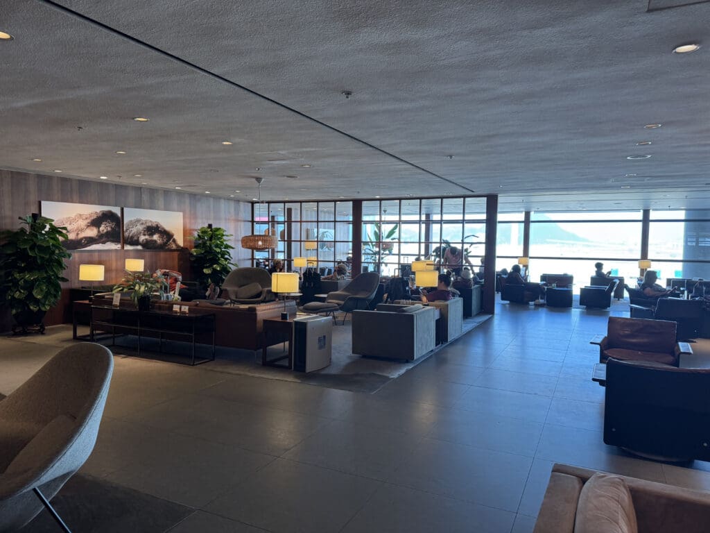 a room with a large window and a large couch