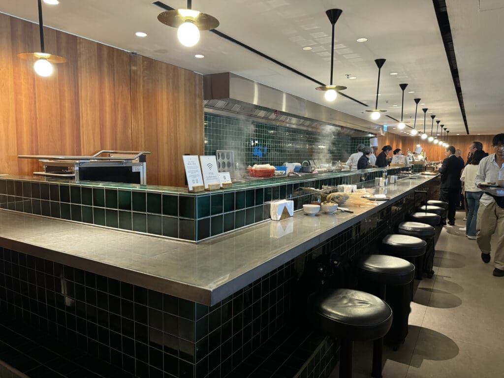 a restaurant with a counter and stools