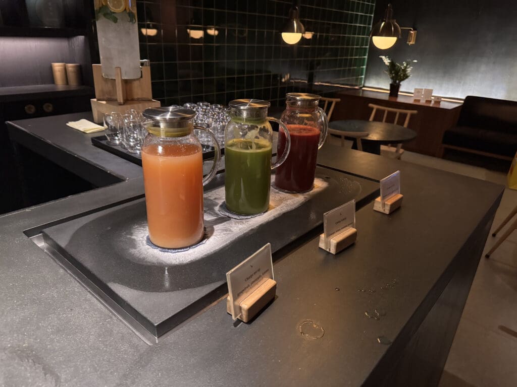 a group of juices in a glass jar