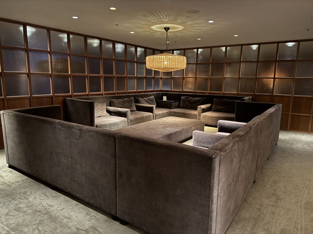 a room with a chandelier and couches