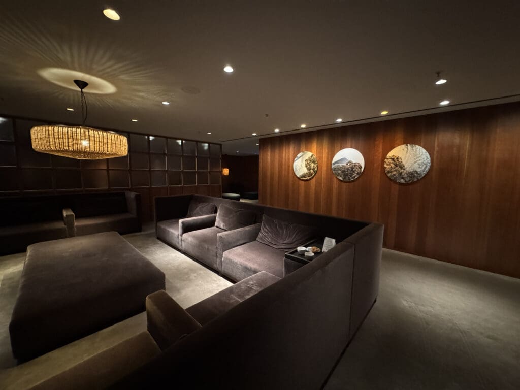 a room with couches and a chandelier