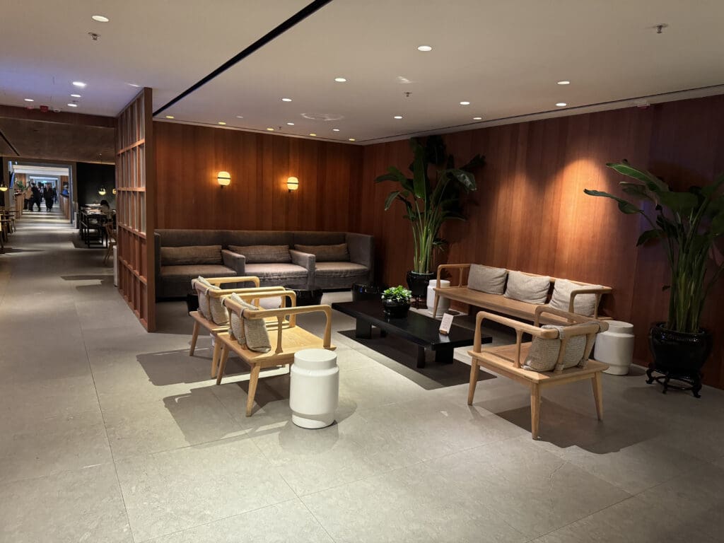 a room with a couch and chairs