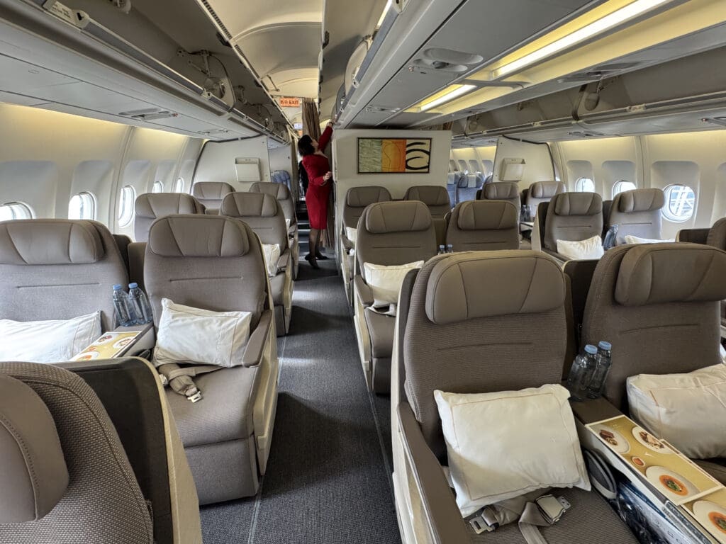 a person standing in the back of an airplane