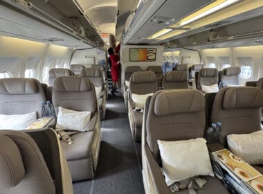 a person standing in the back of an airplane