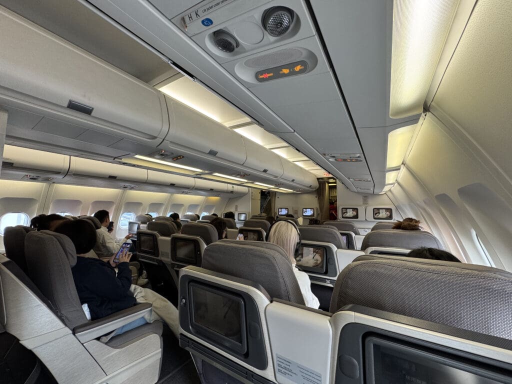 a group of people sitting in an airplane