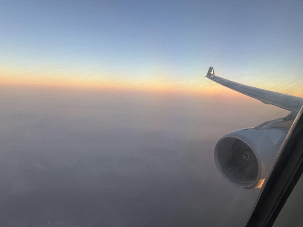 an airplane wing and the sky