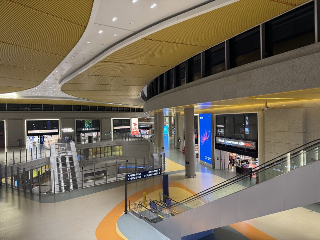 a large building with escalators and stairs