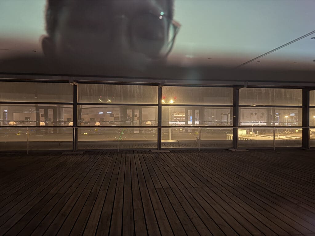 a room with a window and a wood floor