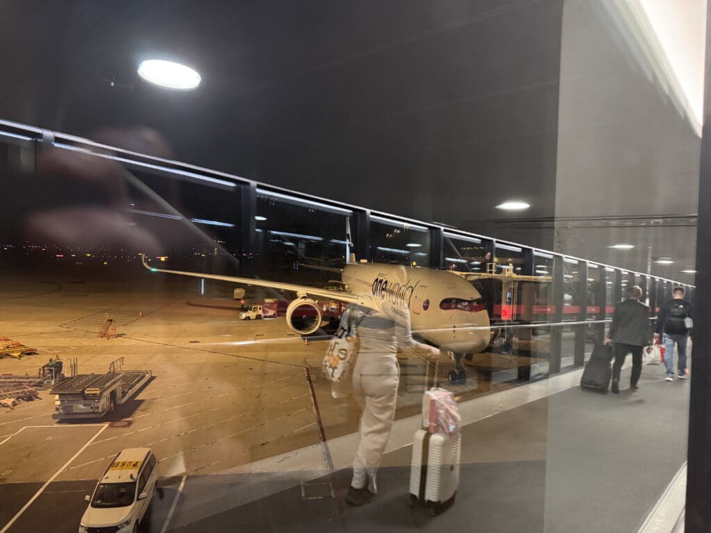 a person walking with luggage in an airport