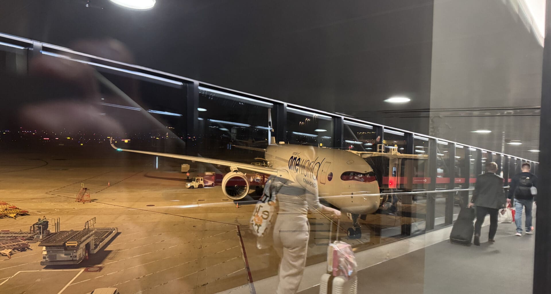 a person walking with luggage in an airport