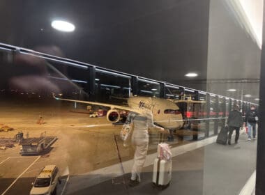 a person walking with luggage in an airport