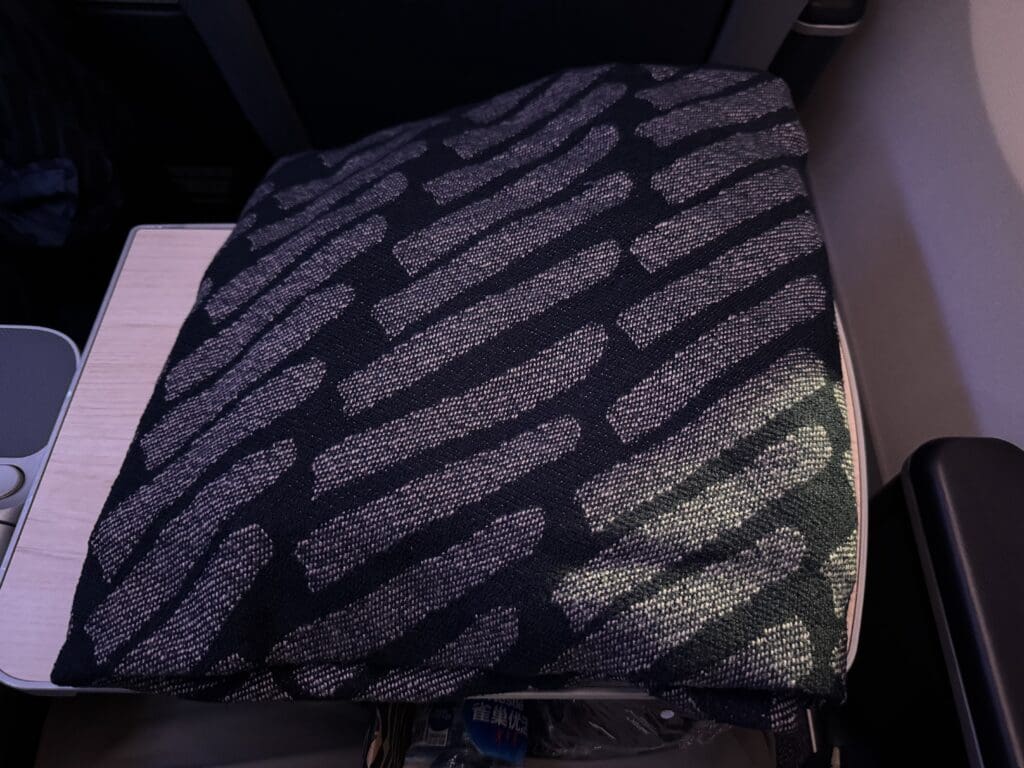 a black and silver patterned pillow