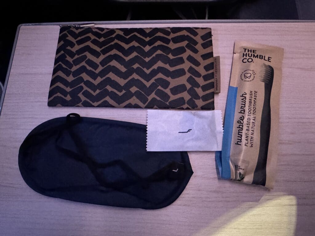 a black mask and a brown bag on a table