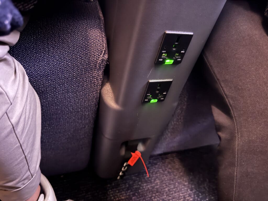 a power outlet with green lights