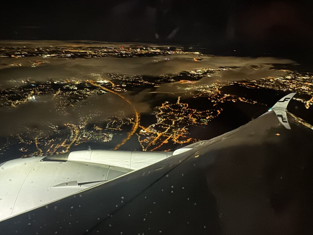 an airplane wing and wing of an airplane at night