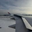 an airplane wing in the snow
