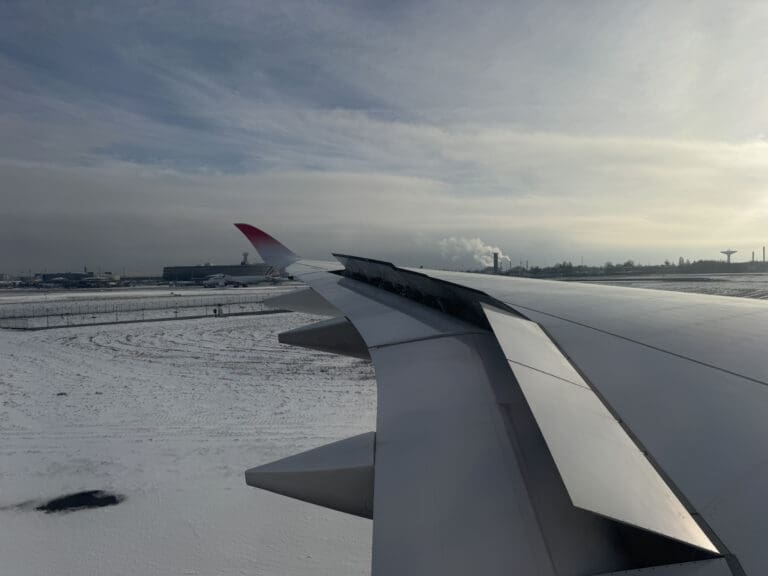 an airplane wing in the snow