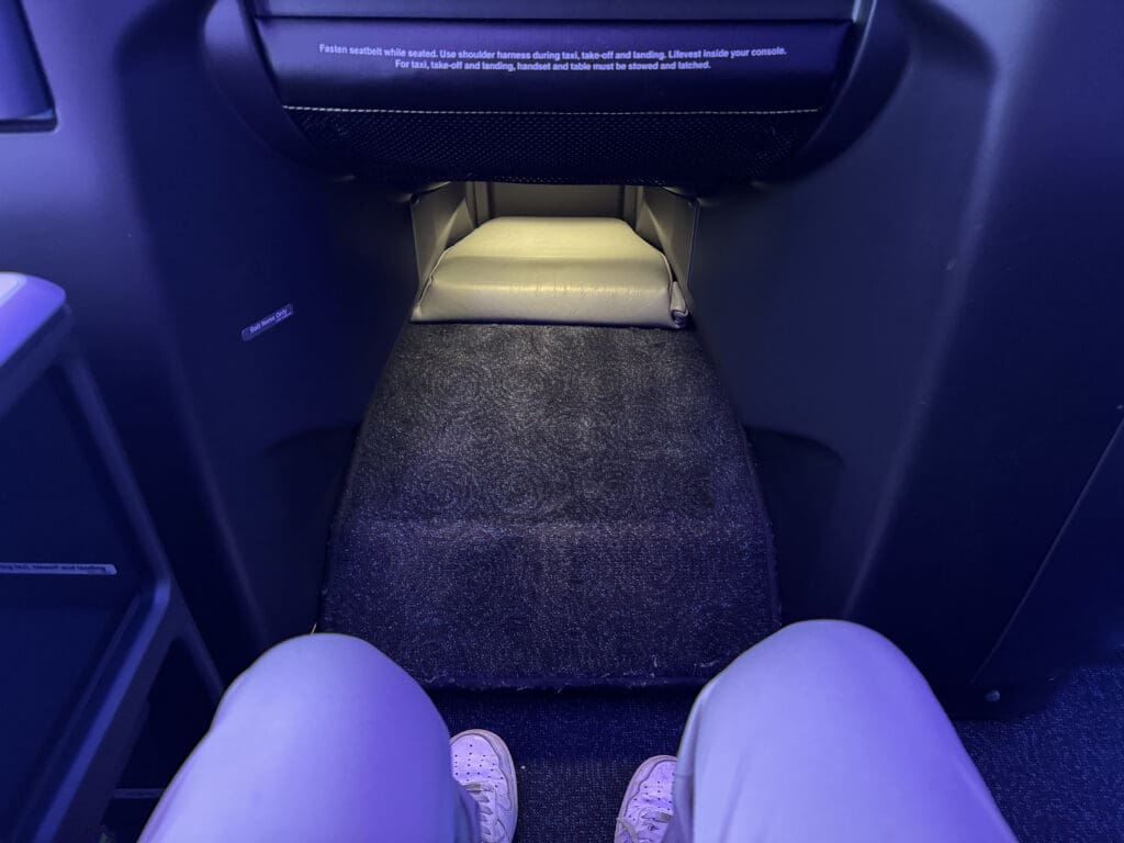 a person's legs in a seat