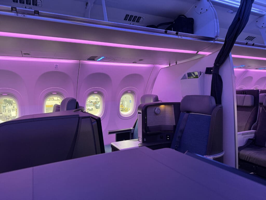 an airplane with purple lights