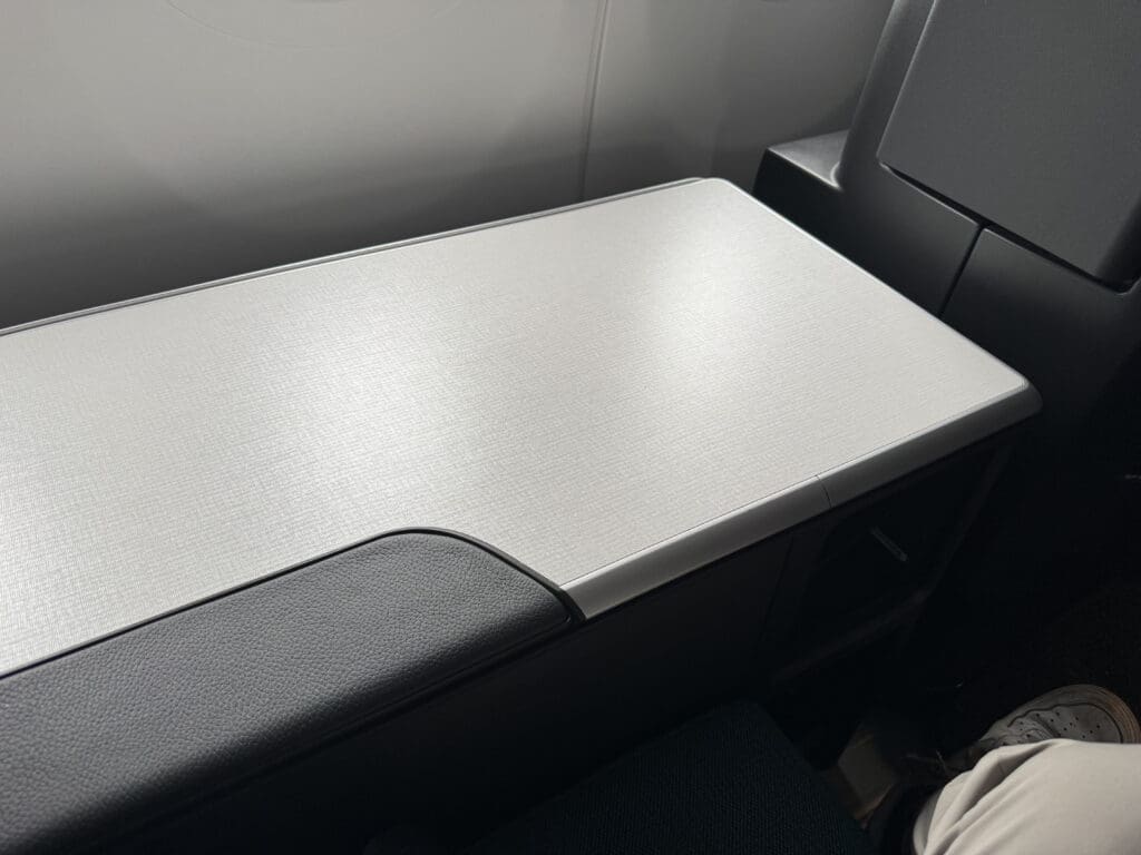 a white and black arm rest