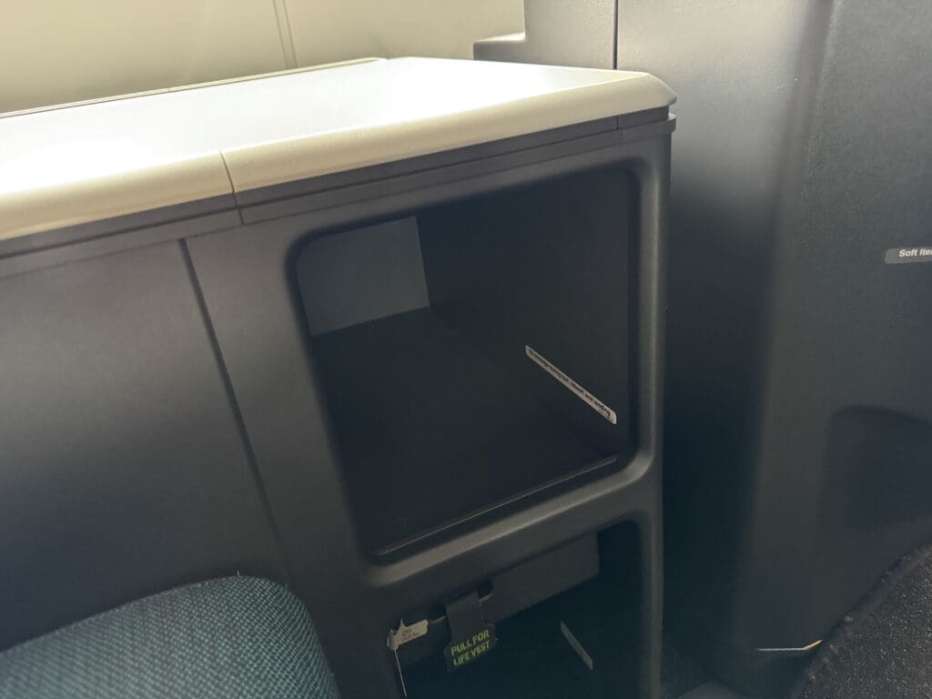 a black and white object with a white lid