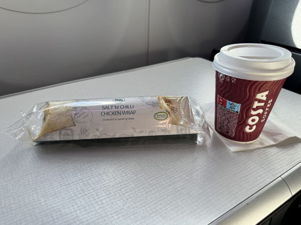 a coffee cup and food on a table