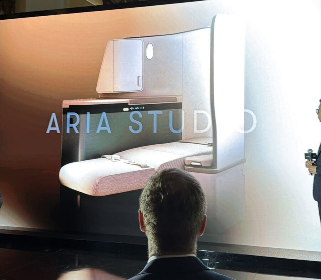 a man looking at a drawing of a room