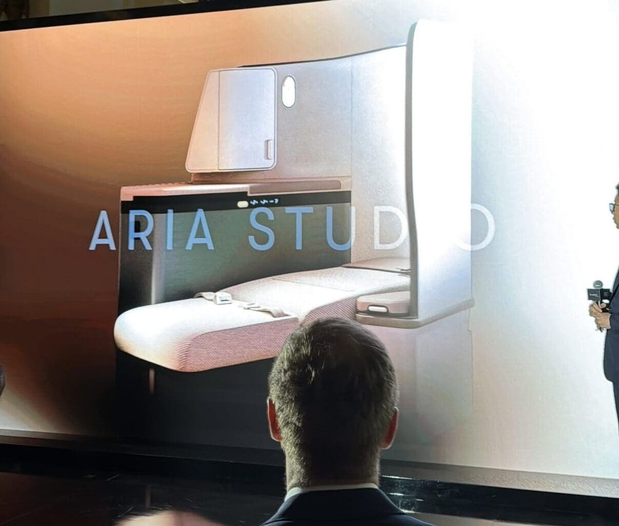 a man looking at a drawing of a room