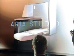 a man looking at a drawing of a room