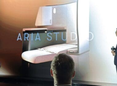 a man looking at a drawing of a room