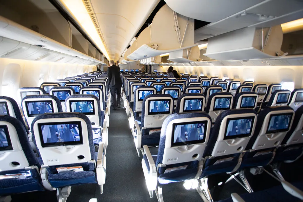 a man walking in an airplane