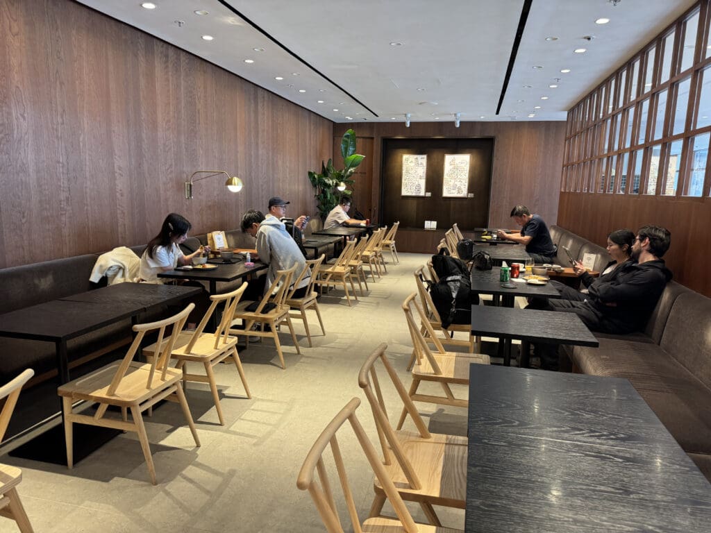 a group of people sitting at tables in a room