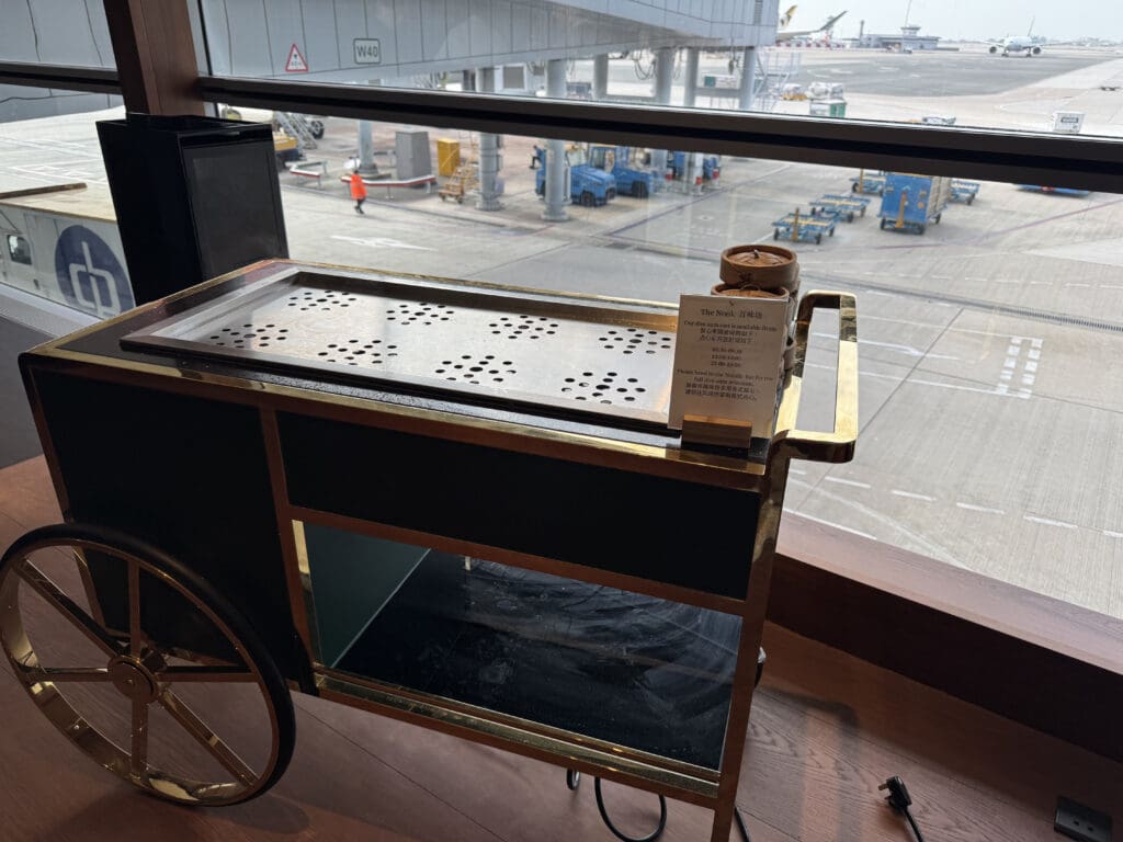 a cart with a cart on it and a window with a view of an airport