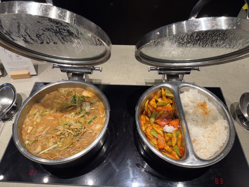 two bowls of food on a stove