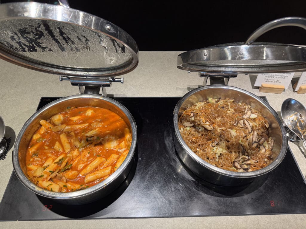 a couple of pots with food in them