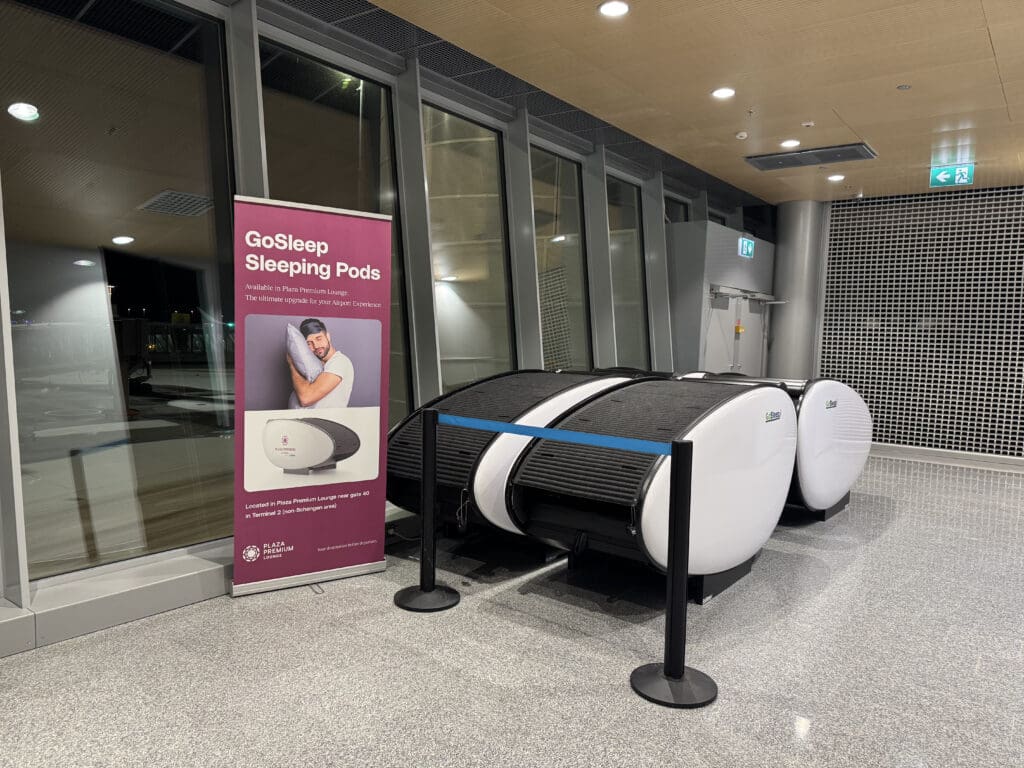 a sign next to a sleeping pod