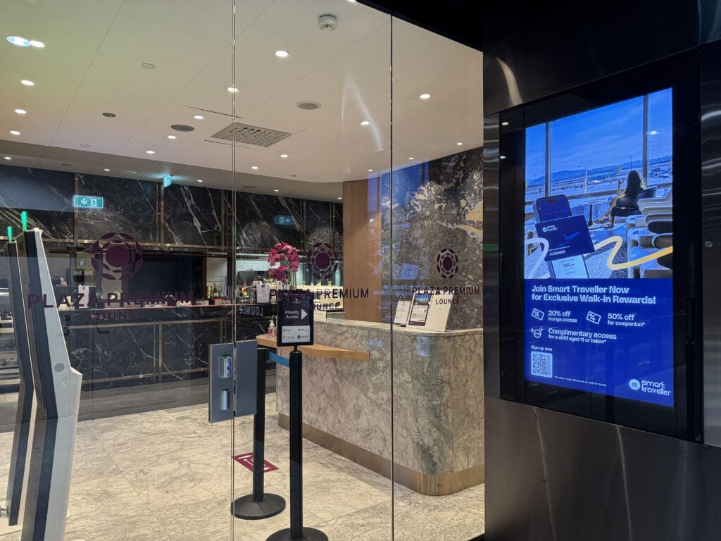 a glass wall with a screen in front of a counter