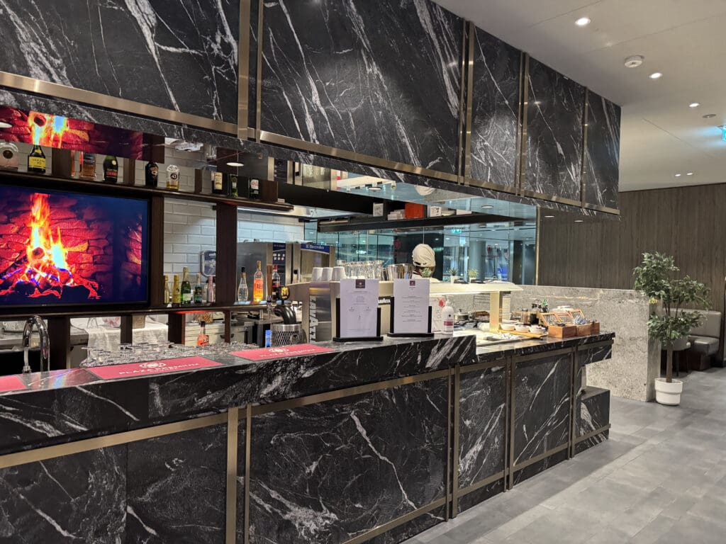 a bar with black marble counter tops