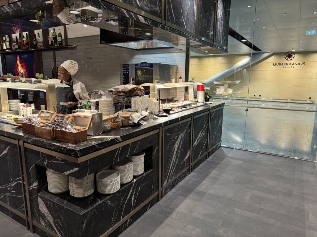 a person behind a counter in a restaurant